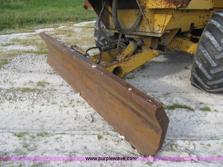 image for item B2702 1999 Vermeer V4750 trencher/backhoe combo with cable plow