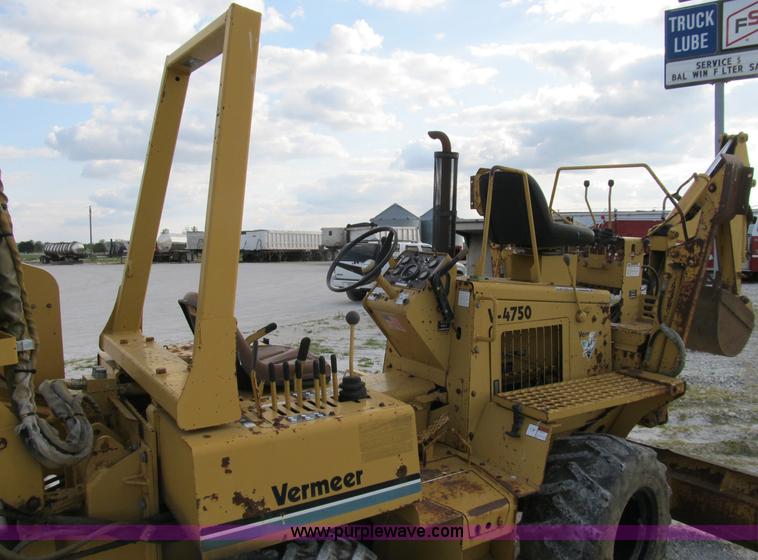 image for item B2702 1999 Vermeer V4750 trencher/backhoe combo with cable plow