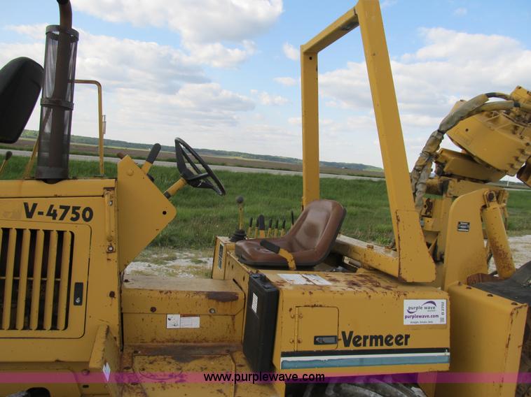 image for item B2702 1999 Vermeer V4750 trencher/backhoe combo with cable plow