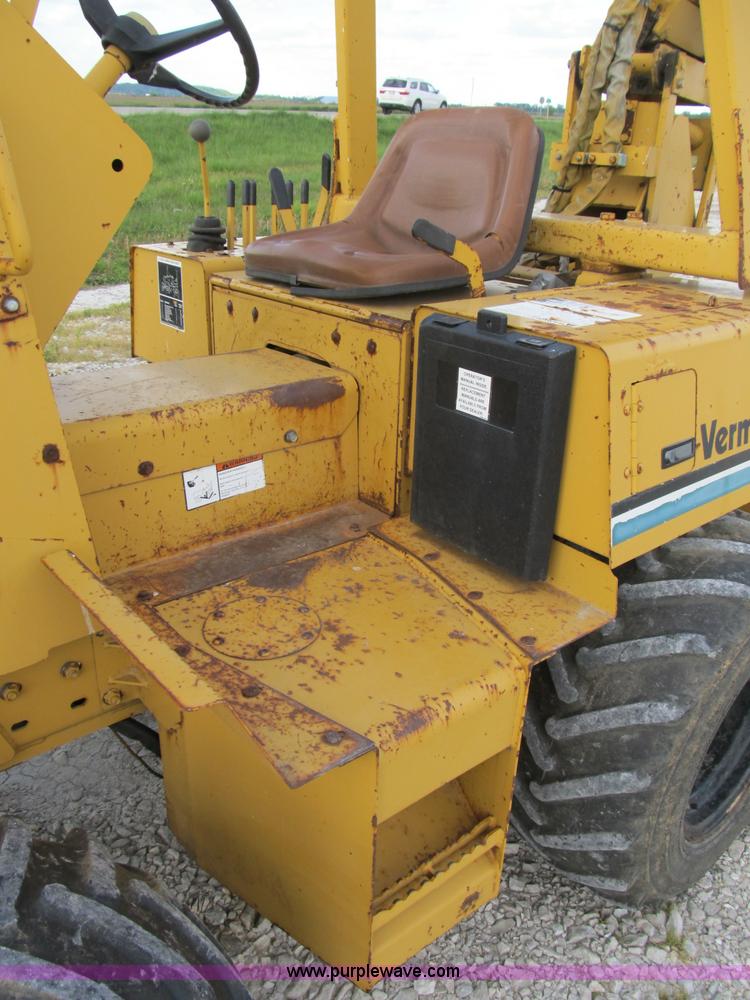 image for item B2702 1999 Vermeer V4750 trencher/backhoe combo with cable plow