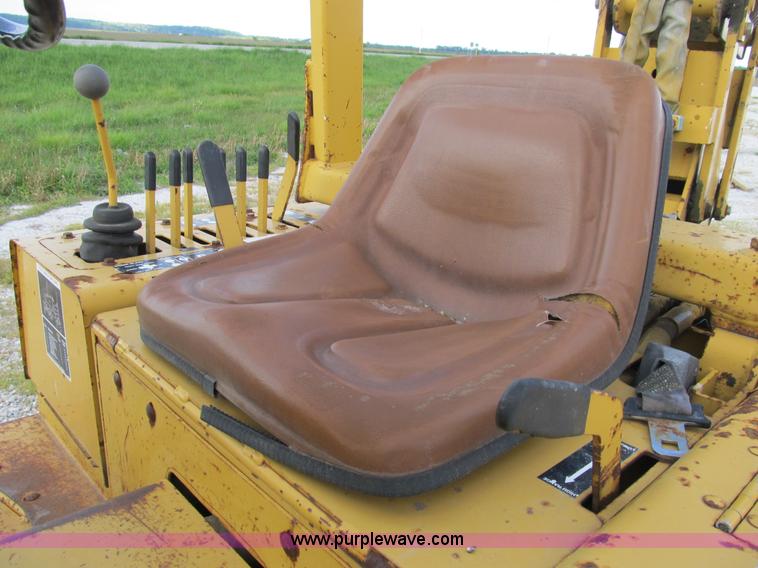 image for item B2702 1999 Vermeer V4750 trencher/backhoe combo with cable plow