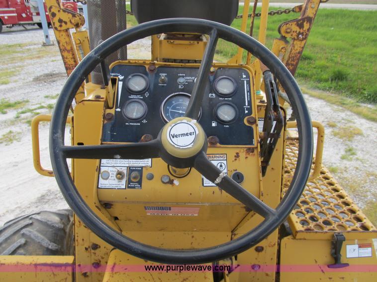 image for item B2702 1999 Vermeer V4750 trencher/backhoe combo with cable plow