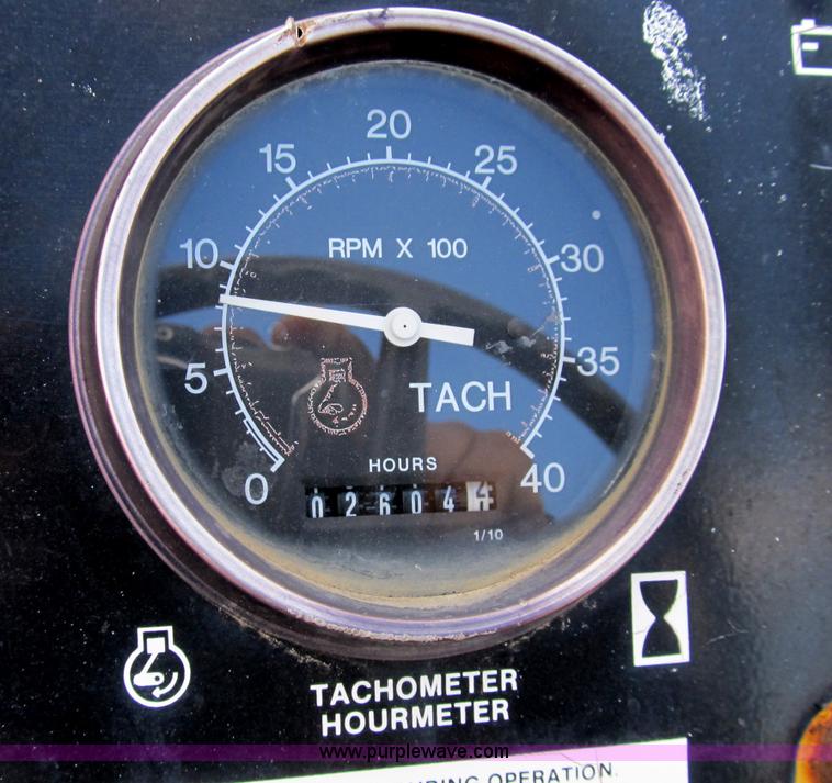 image for item B2702 1999 Vermeer V4750 trencher/backhoe combo with cable plow