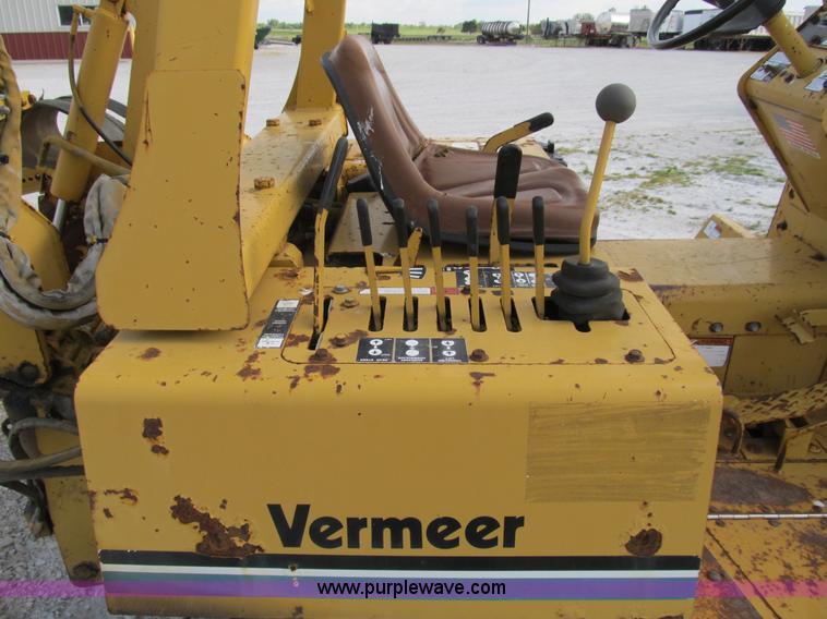 image for item B2702 1999 Vermeer V4750 trencher/backhoe combo with cable plow