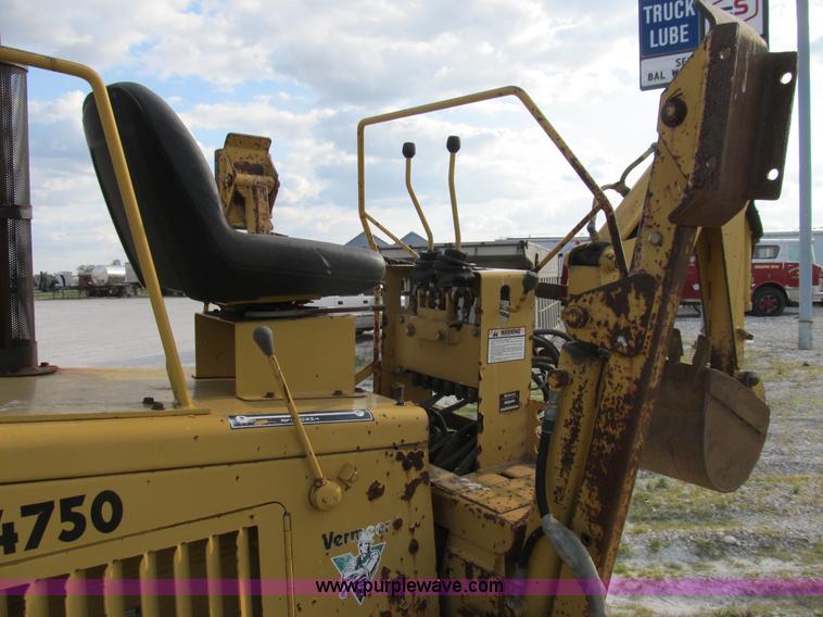 image for item B2702 1999 Vermeer V4750 trencher/backhoe combo with cable plow