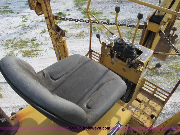 image for item B2702 1999 Vermeer V4750 trencher/backhoe combo with cable plow