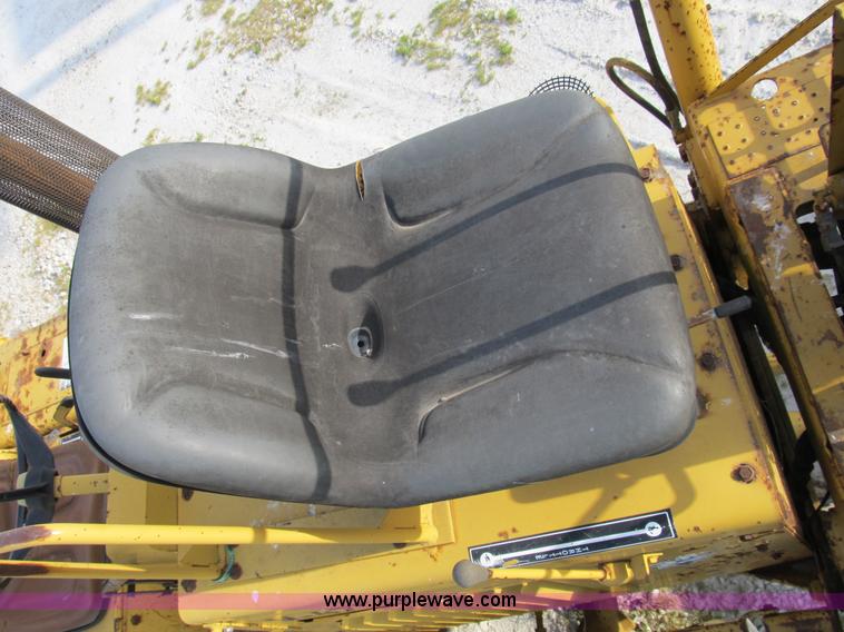 image for item B2702 1999 Vermeer V4750 trencher/backhoe combo with cable plow