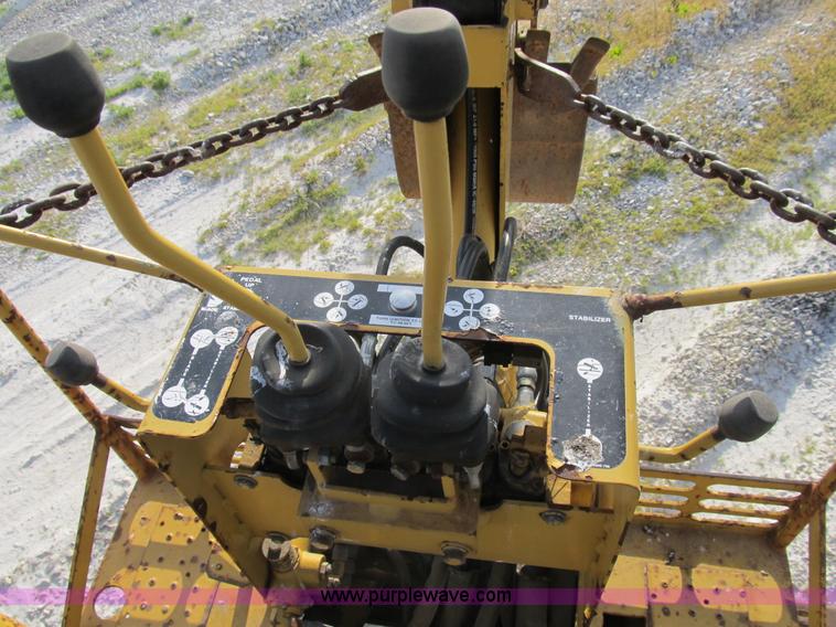 image for item B2702 1999 Vermeer V4750 trencher/backhoe combo with cable plow