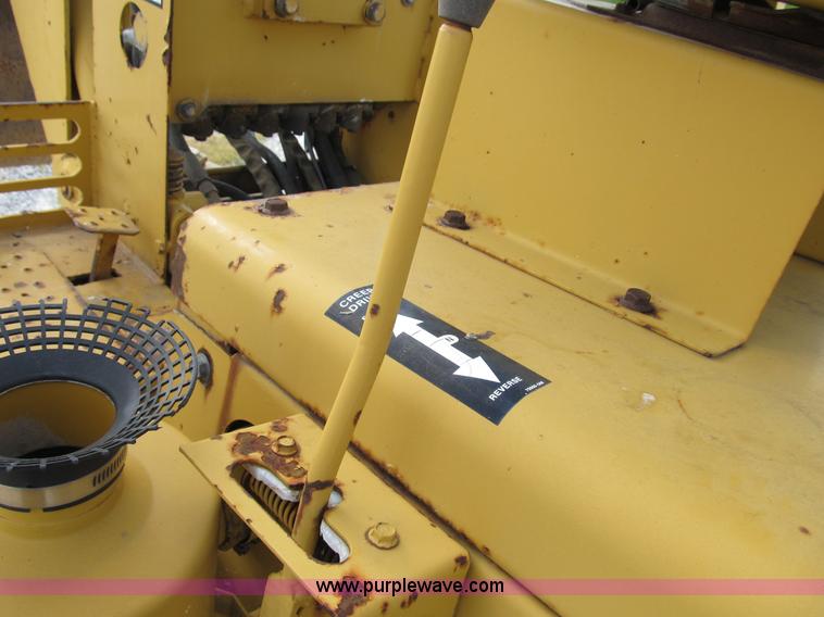 image for item B2702 1999 Vermeer V4750 trencher/backhoe combo with cable plow