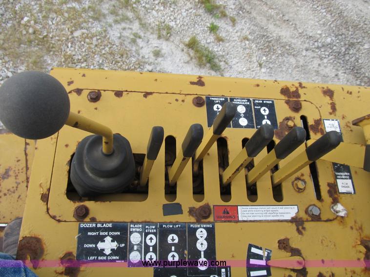 image for item B2702 1999 Vermeer V4750 trencher/backhoe combo with cable plow