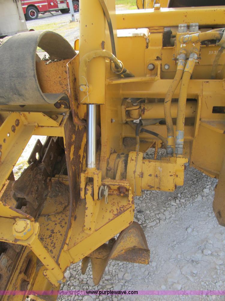 image for item B2702 1999 Vermeer V4750 trencher/backhoe combo with cable plow