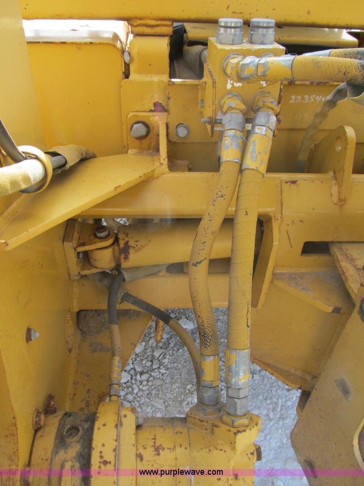image for item B2702 1999 Vermeer V4750 trencher/backhoe combo with cable plow