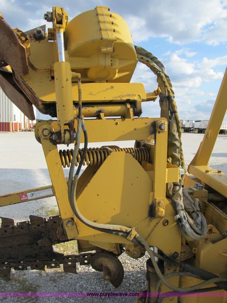 image for item B2702 1999 Vermeer V4750 trencher/backhoe combo with cable plow