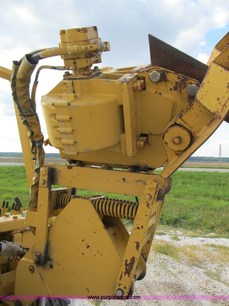 image for item B2702 1999 Vermeer V4750 trencher/backhoe combo with cable plow