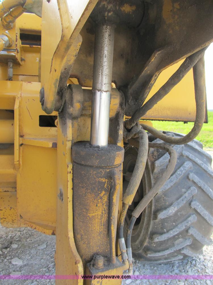 image for item B2702 1999 Vermeer V4750 trencher/backhoe combo with cable plow