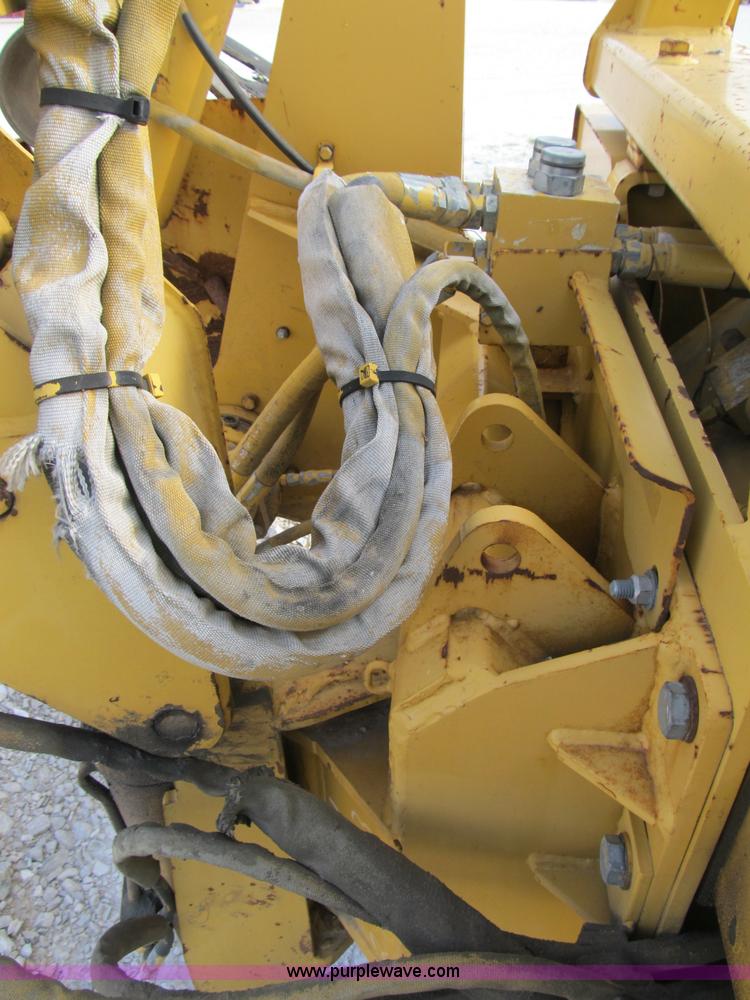 image for item B2702 1999 Vermeer V4750 trencher/backhoe combo with cable plow