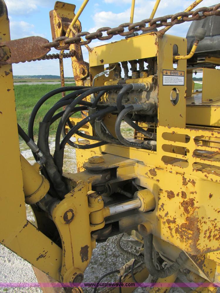 image for item B2702 1999 Vermeer V4750 trencher/backhoe combo with cable plow