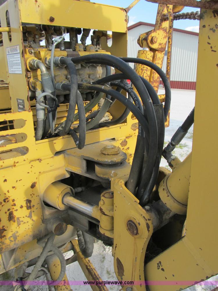 image for item B2702 1999 Vermeer V4750 trencher/backhoe combo with cable plow