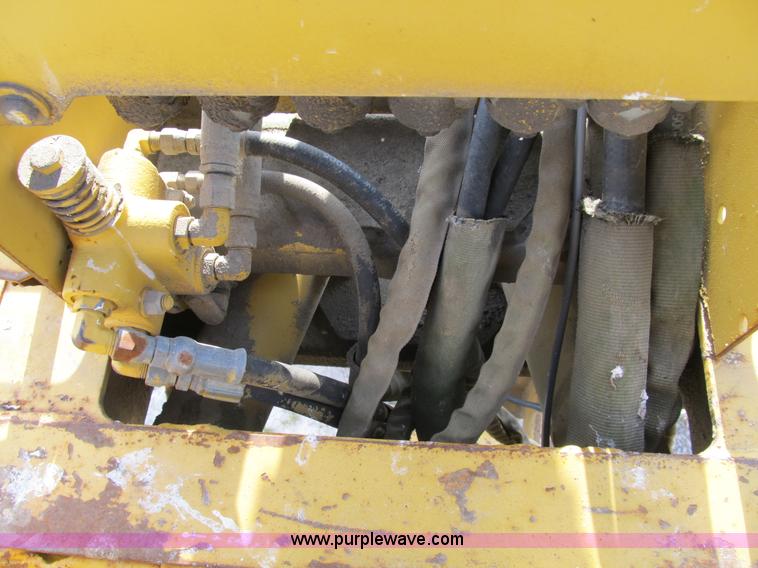 image for item B2702 1999 Vermeer V4750 trencher/backhoe combo with cable plow