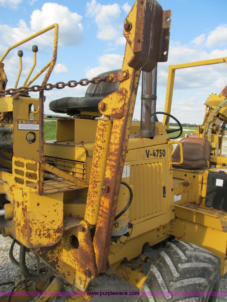 image for item B2702 1999 Vermeer V4750 trencher/backhoe combo with cable plow