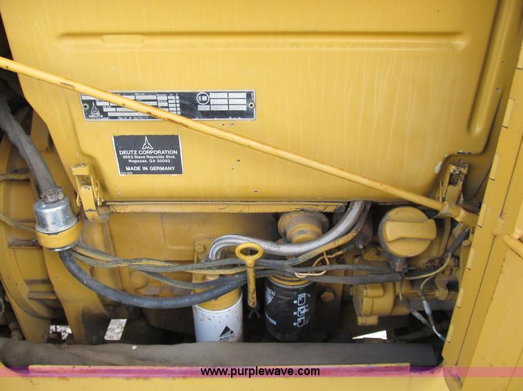 image for item B2702 1999 Vermeer V4750 trencher/backhoe combo with cable plow