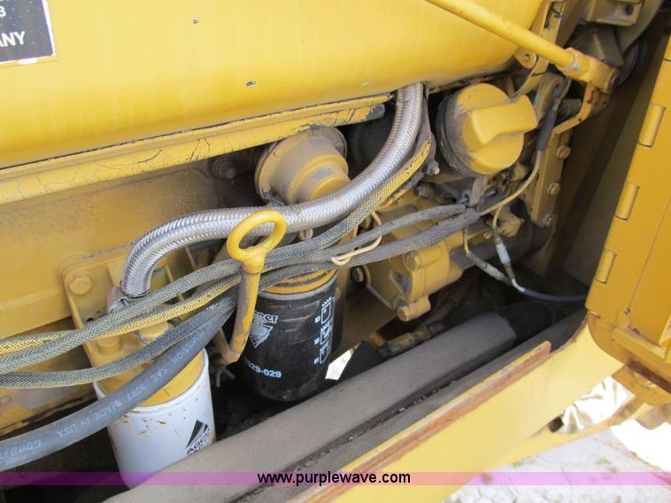 image for item B2702 1999 Vermeer V4750 trencher/backhoe combo with cable plow