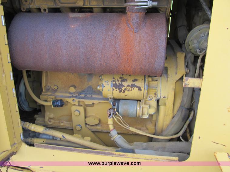 image for item B2702 1999 Vermeer V4750 trencher/backhoe combo with cable plow