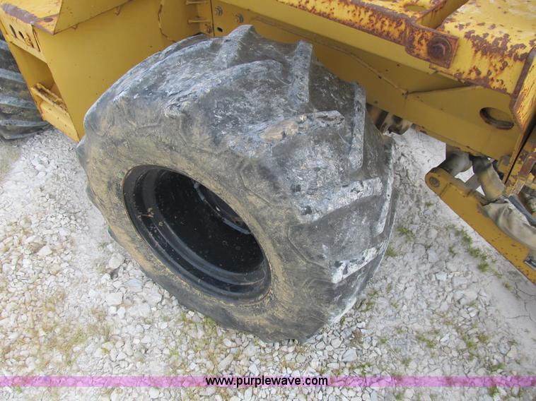 image for item B2702 1999 Vermeer V4750 trencher/backhoe combo with cable plow