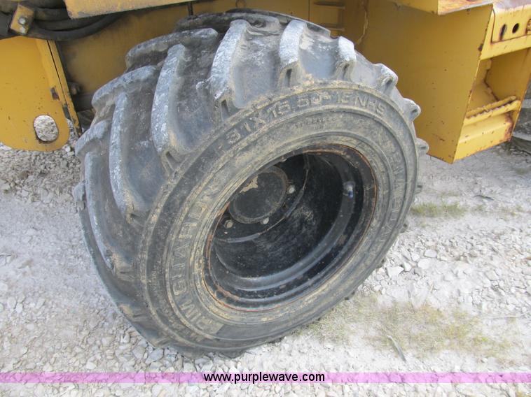 image for item B2702 1999 Vermeer V4750 trencher/backhoe combo with cable plow