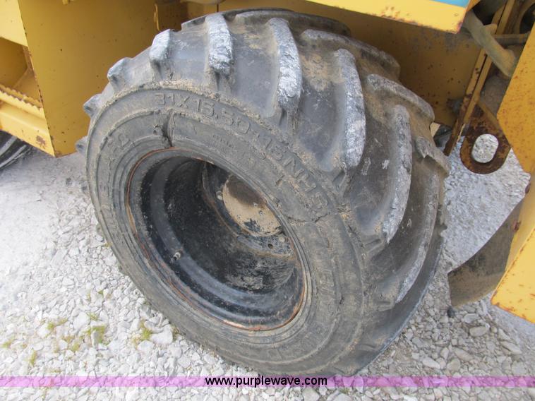 image for item B2702 1999 Vermeer V4750 trencher/backhoe combo with cable plow