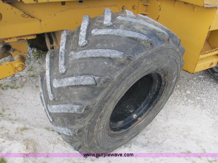 image for item B2702 1999 Vermeer V4750 trencher/backhoe combo with cable plow