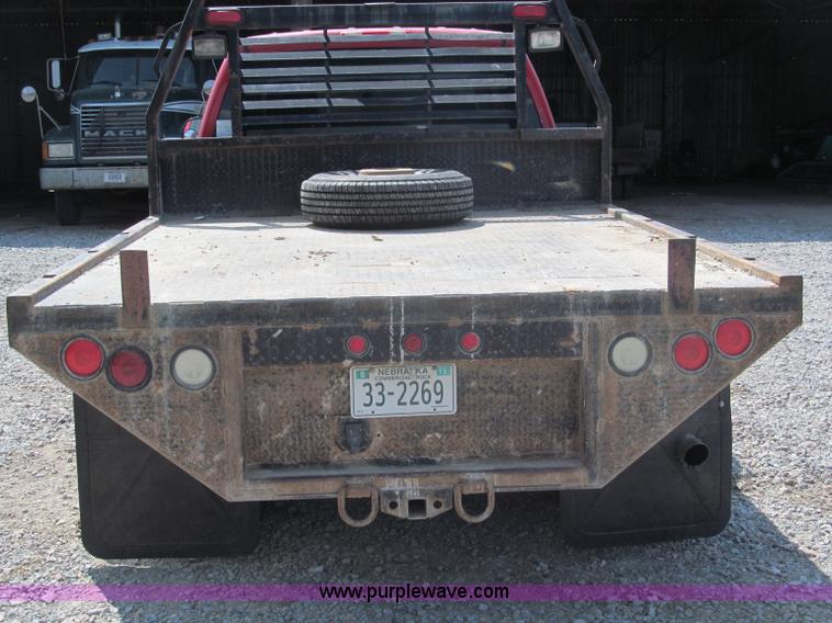 image for item B5145 2004 GMC 3500 SLE crew cab flatbed pickup truck