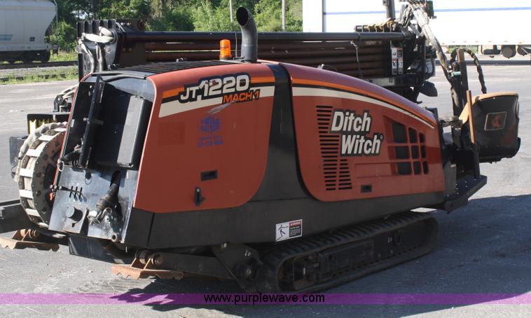 image for item B6606 2005 Ditch Witch 1220 Mach I directional drill with mud mixer and trailer