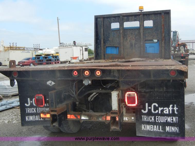 image for item D4057 1987 Ford F700 flatbed truck