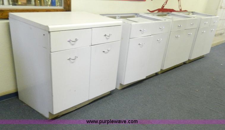 image for item T9857 (4) 36"W metal base cabinets