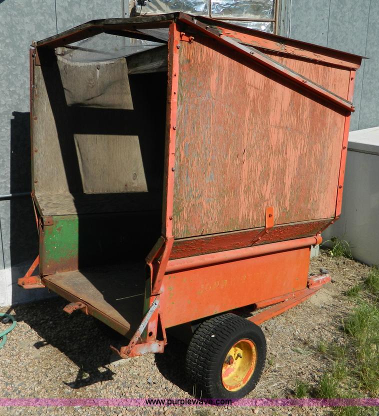 image for item T9890 Two wheel pull behind dump cart