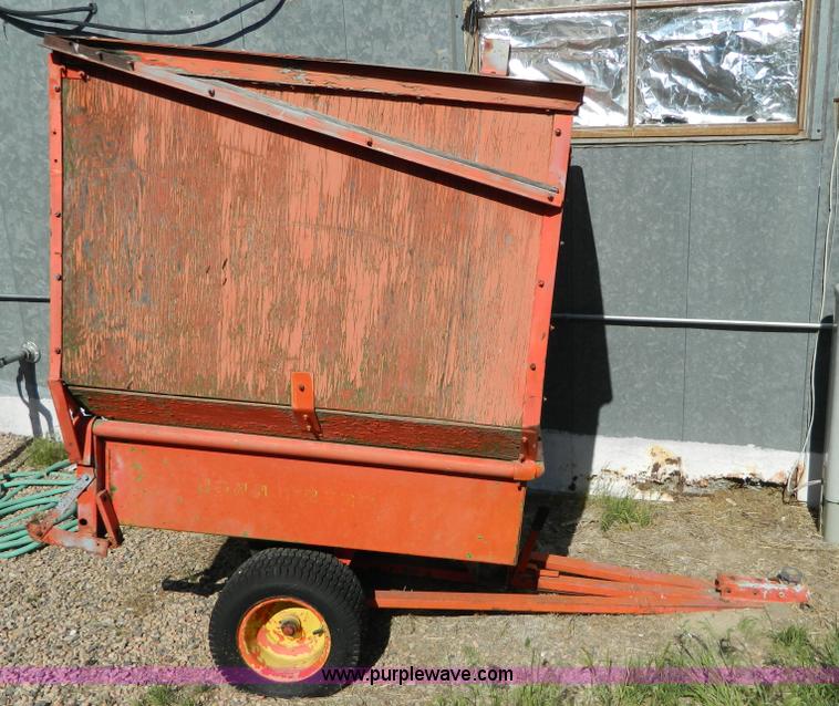 image for item T9890 Two wheel pull behind dump cart
