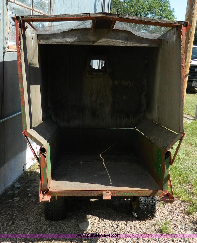 image for item T9890 Two wheel pull behind dump cart