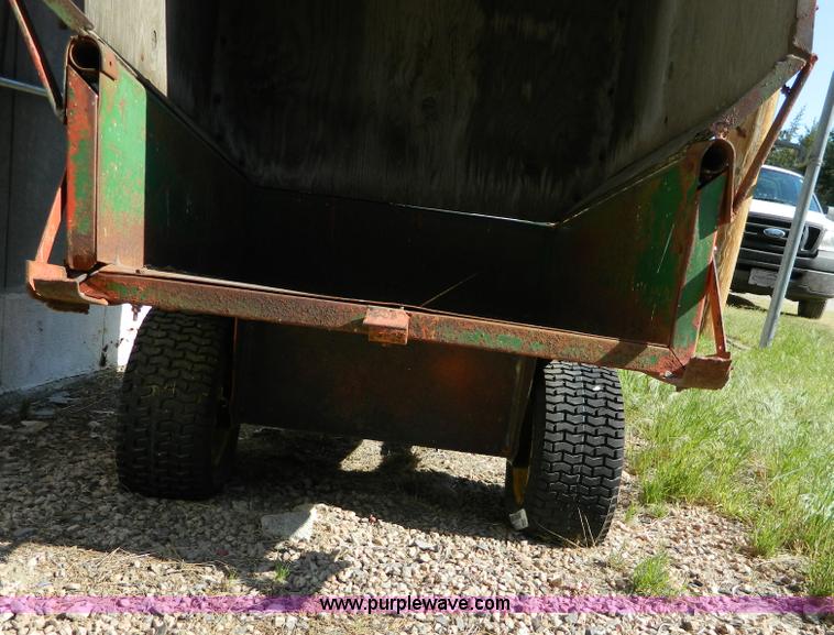 image for item T9890 Two wheel pull behind dump cart