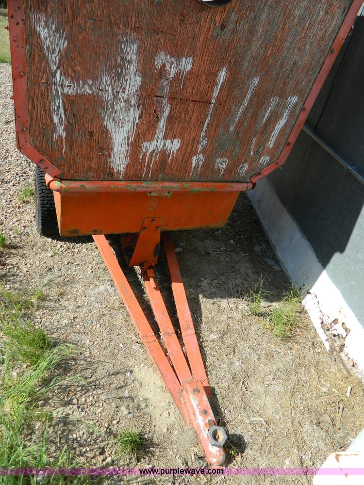 image for item T9890 Two wheel pull behind dump cart