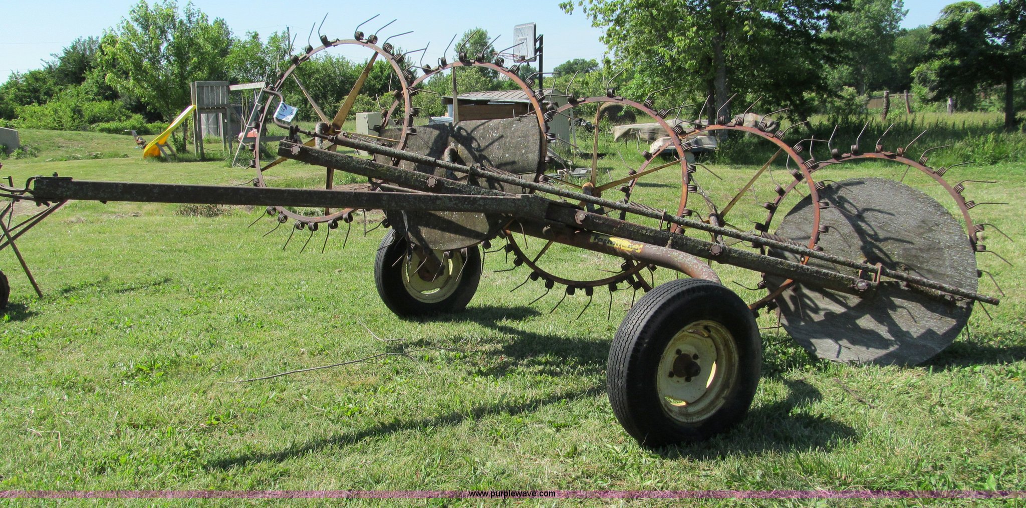 Farm hand five wheel hay rake in Peculiar, MO Item C2176 sold