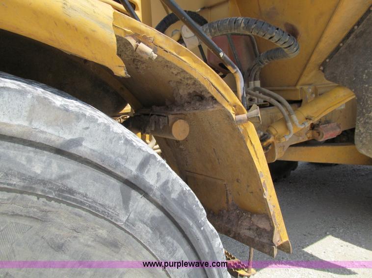 image for item A8313 2004 Caterpillar 740 articulated dump truck