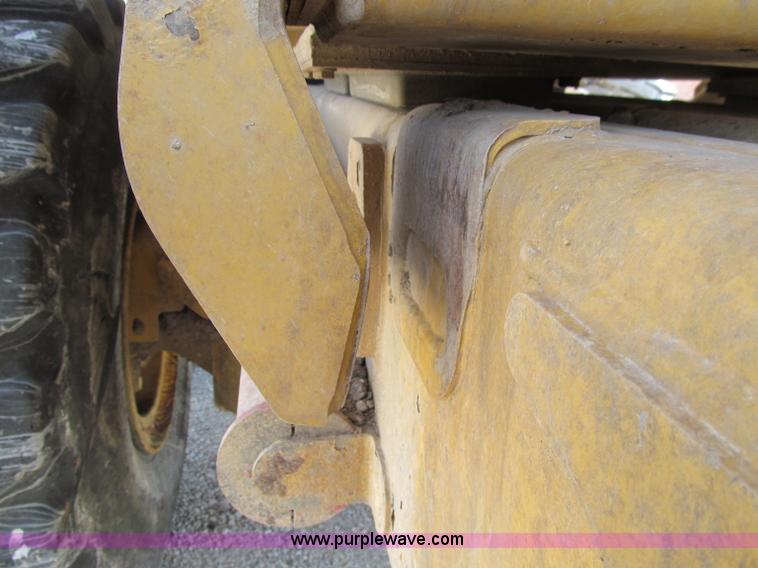 image for item A8313 2004 Caterpillar 740 articulated dump truck