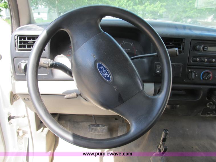 image for item B2709 2004 Ford F650 XL Super Duty flat bed truck