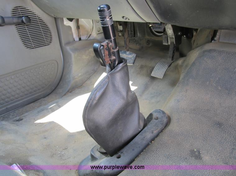 image for item B2709 2004 Ford F650 XL Super Duty flat bed truck