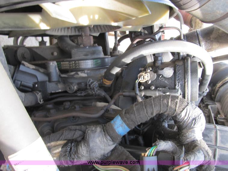 image for item B2709 2004 Ford F650 XL Super Duty flat bed truck