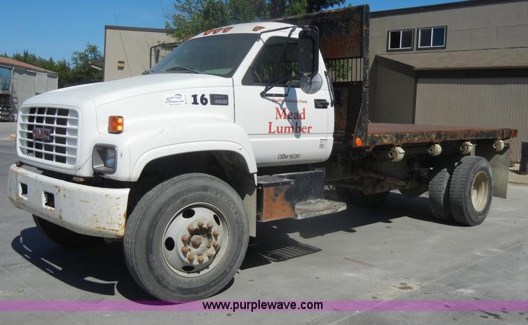 image for item D4117 1998 GMC C6500 flatbed truck