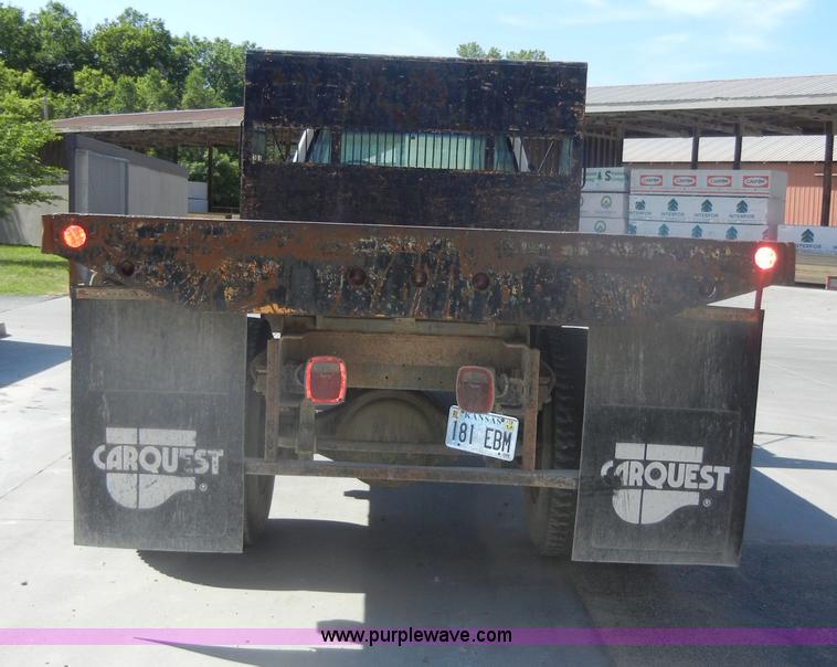 image for item D4117 1998 GMC C6500 flatbed truck