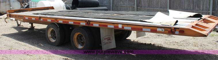 image for item D7995 2003 tandem axle tilt deck trailer