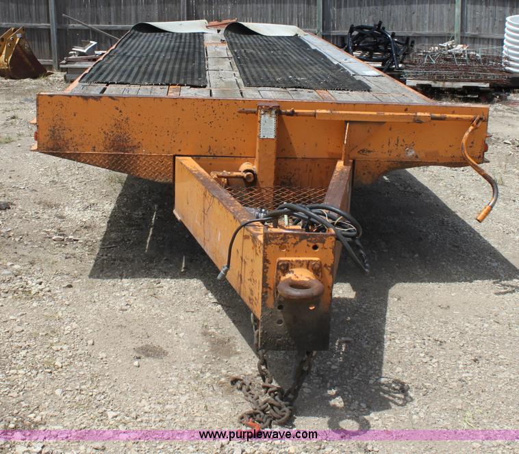 image for item D7995 2003 tandem axle tilt deck trailer